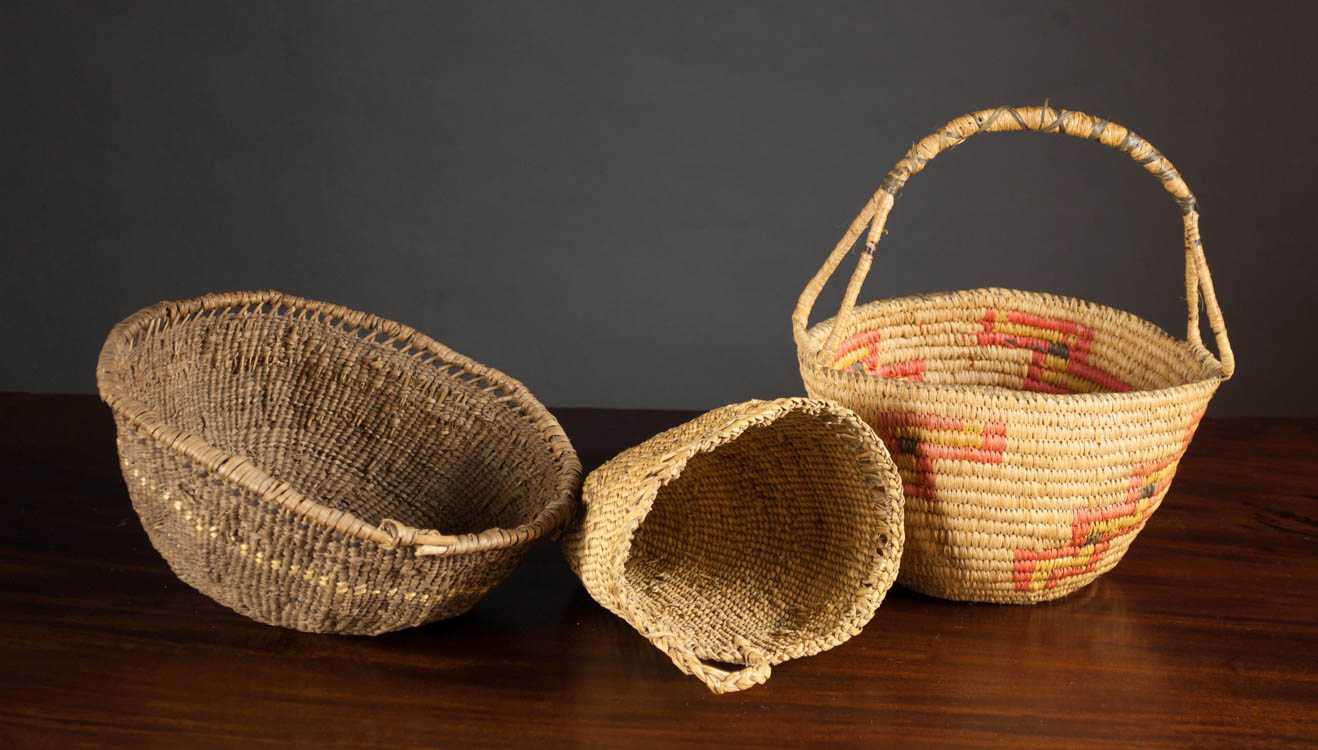 Appraisal: THREE NATIVE AMERICAN BASKETS the first a Quinault basket with