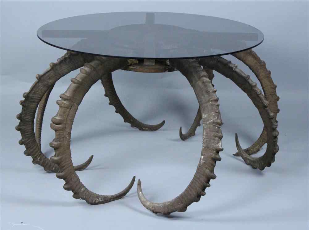 Appraisal: ANTLER HORN TABLE WITH ROUND OYNX GLASS TOP having a