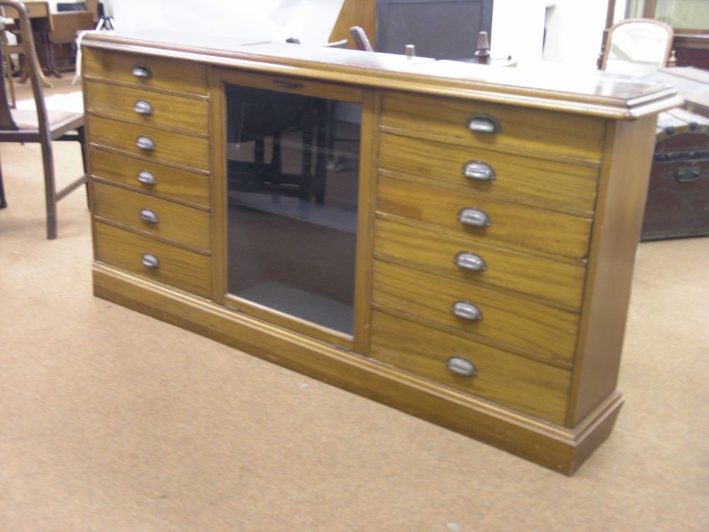 Appraisal: An early th century mahogany chemist's cabinet central hinged glazed