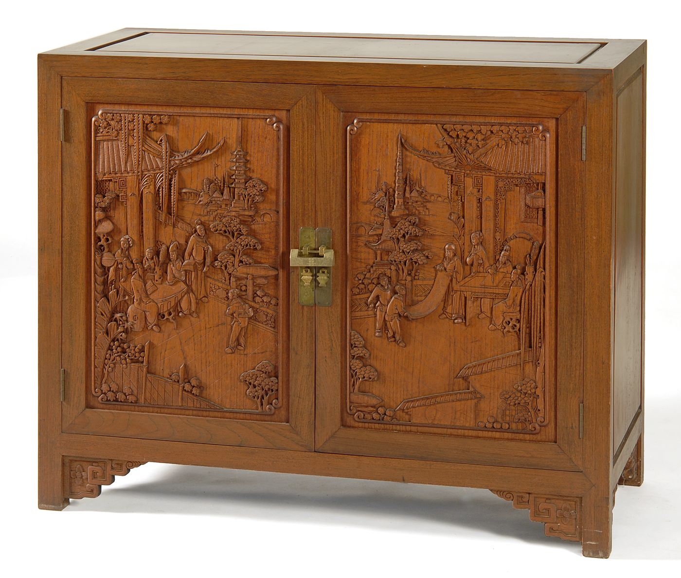 Appraisal: CHINESE-STYLE CARVED TWO-DOOR CABINET In mahogany with two cupboard doors