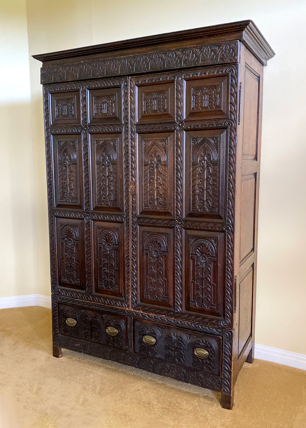 Appraisal: EARLY CARVED OAK ARMOIRE Large Oak armoire having a heavily