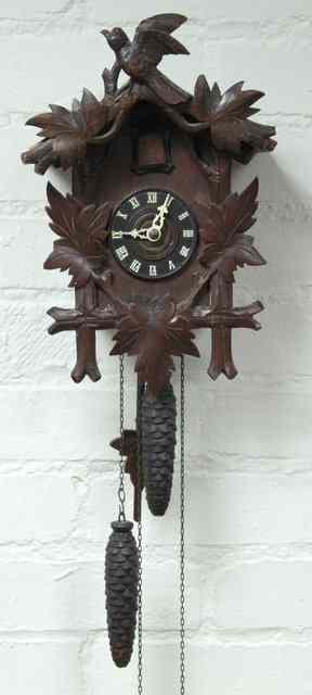 Appraisal: A Black Forest cuckoo clock in a carved case cm