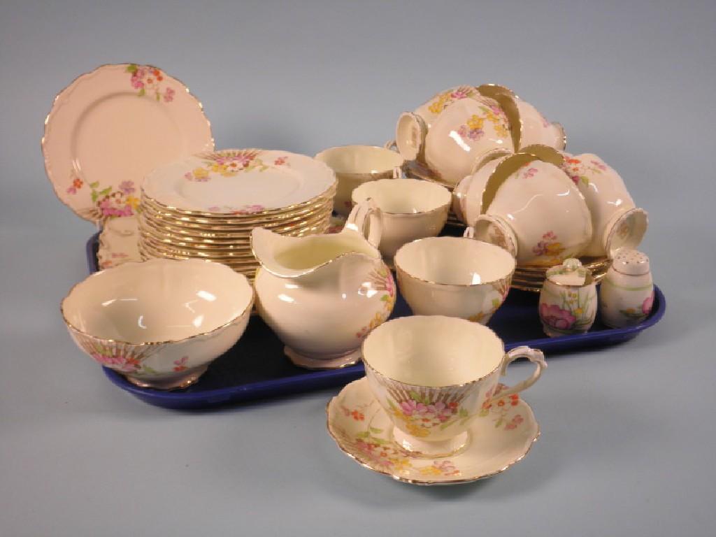 Appraisal: A Paragon Carnival pattern part tea service printed with flowers