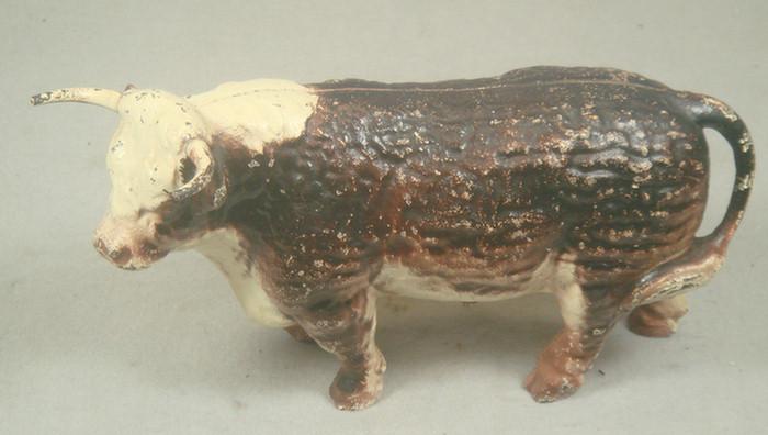 Appraisal: Cast iron doorstop large free standing brown and tan bull