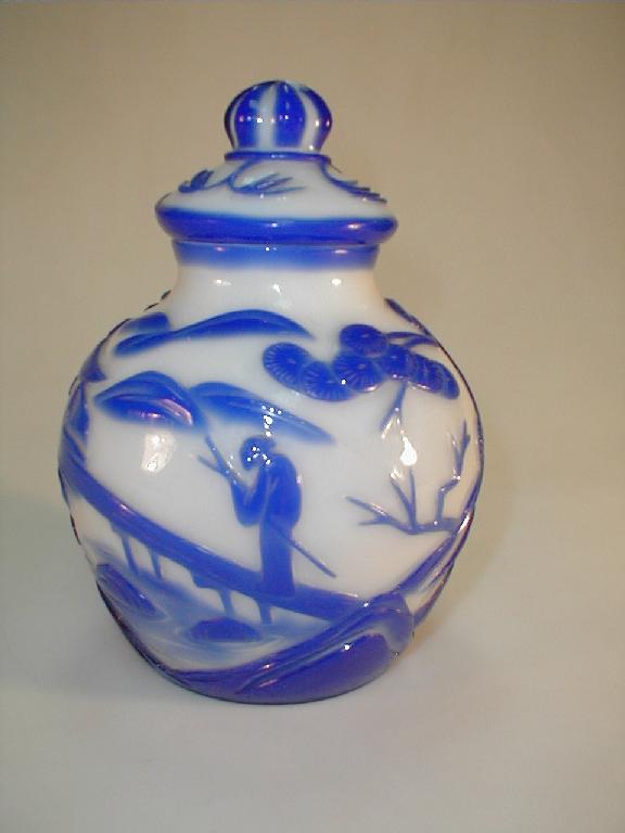 Appraisal: A cameo glass baluster vase and cover blue on white