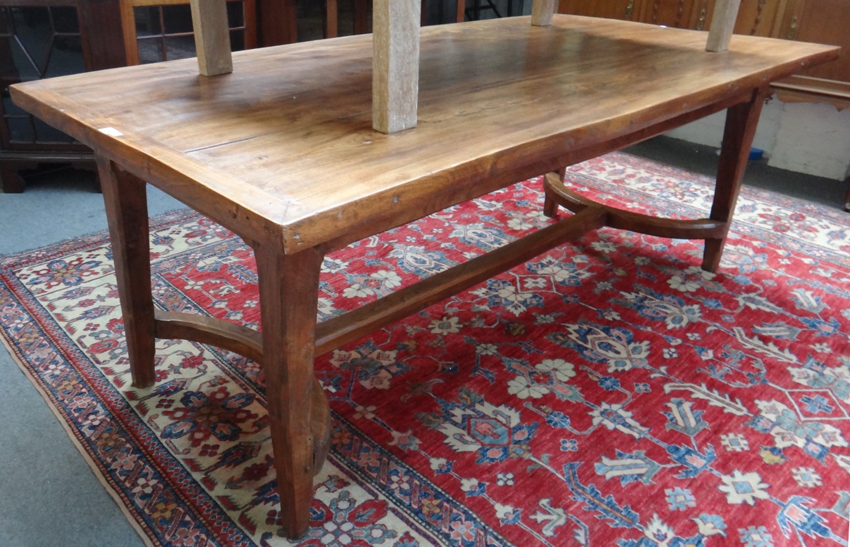 Appraisal: An th century style French plank top table on tapering