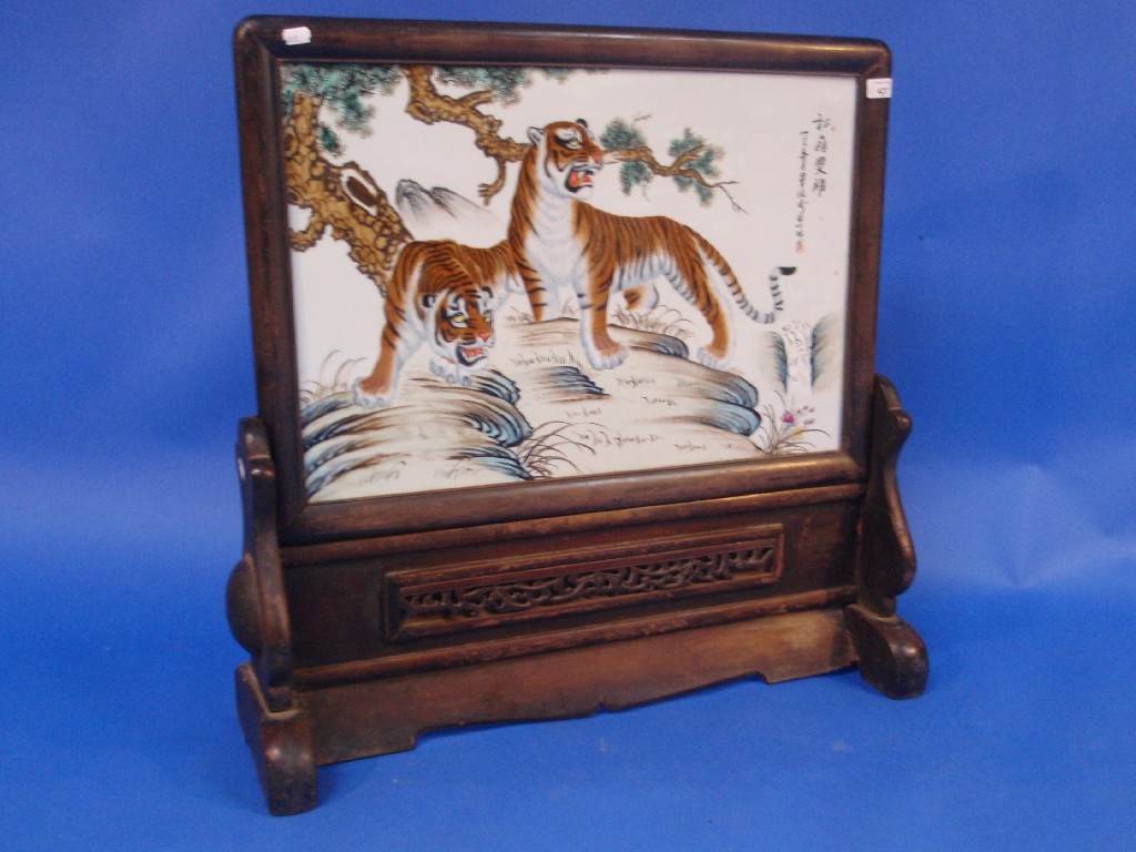 Appraisal: A Chinese painted porcelain table screen depicting a pair of