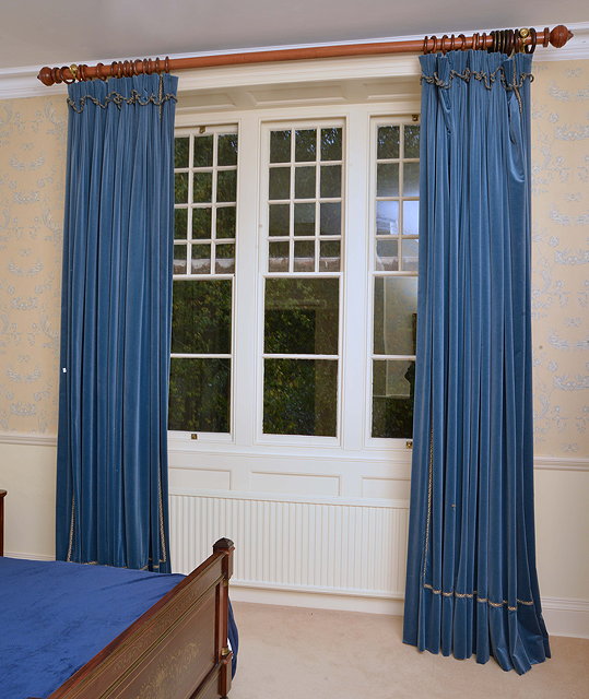 Appraisal: A PAIR OF LARGE BLUE VELVET CURTAINS each approximately cm