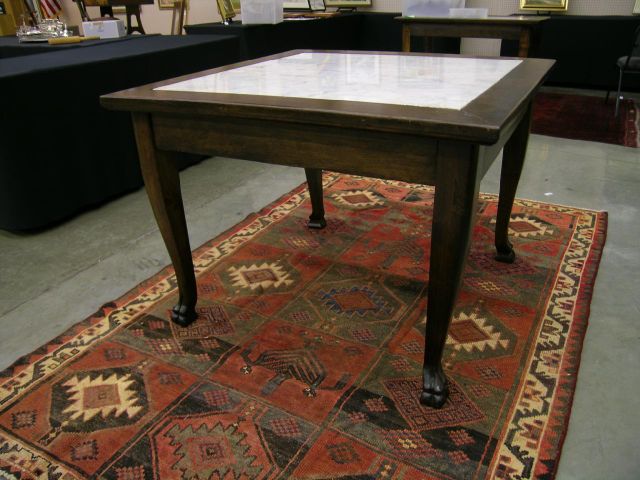 Appraisal: 's marble-top tavern table with carved paw feet x with