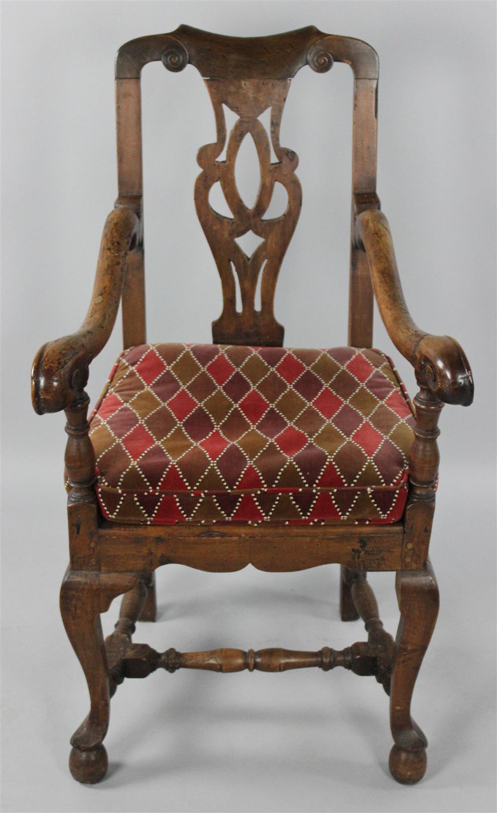 Appraisal: CHIPPENDALE PROVINCIAL FRUITWOOD ARM CHAIR the shaped crest rail over