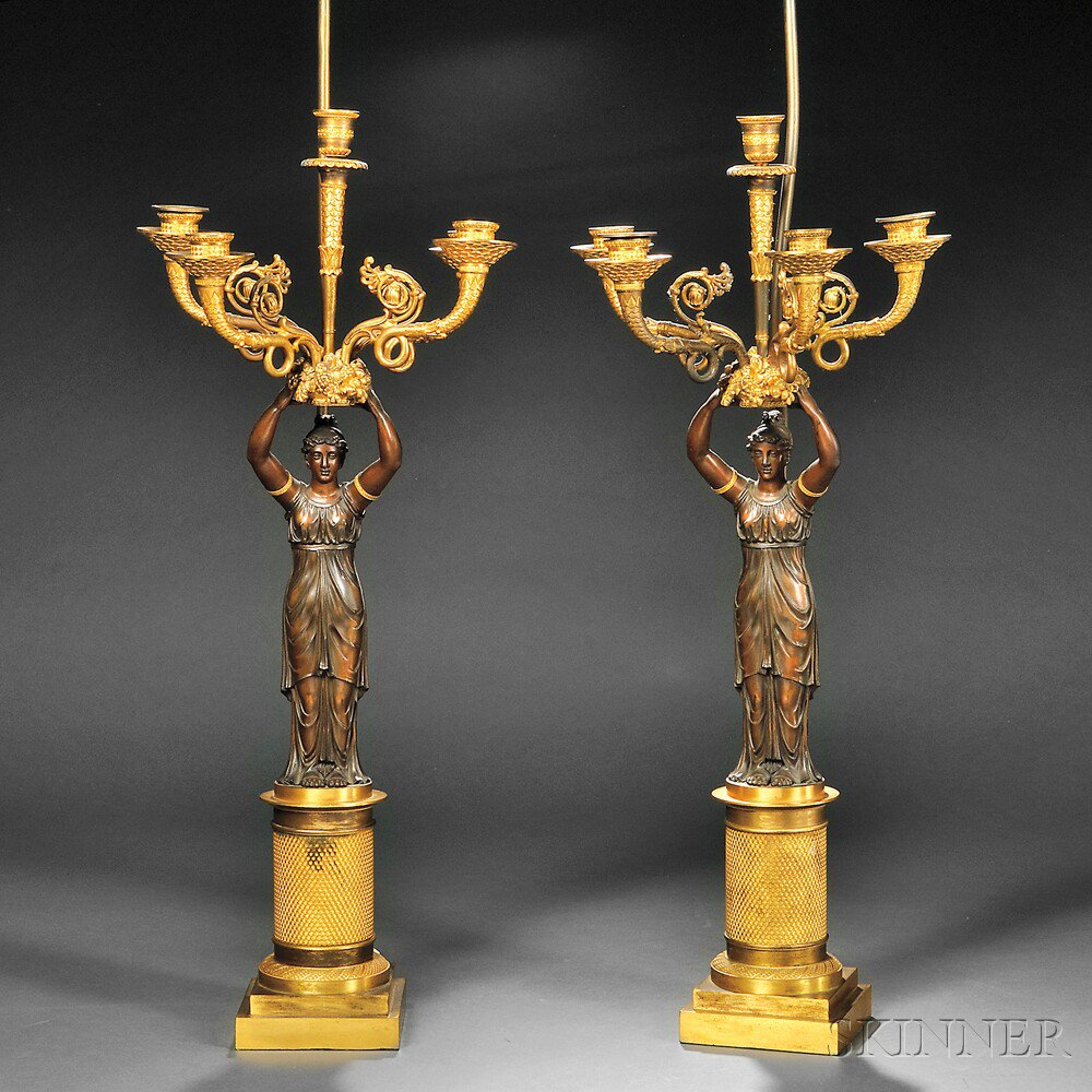 Appraisal: Pair of Empire-style Figural Parcel-gilded Bronze Five-light Candelabra probably France