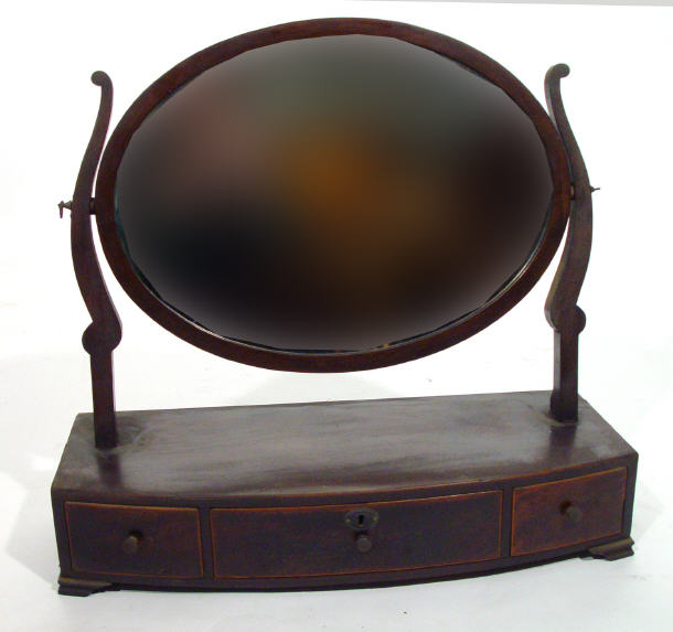 Appraisal: Georgian mahogany toilet mirror the oval mirror supported by sabre