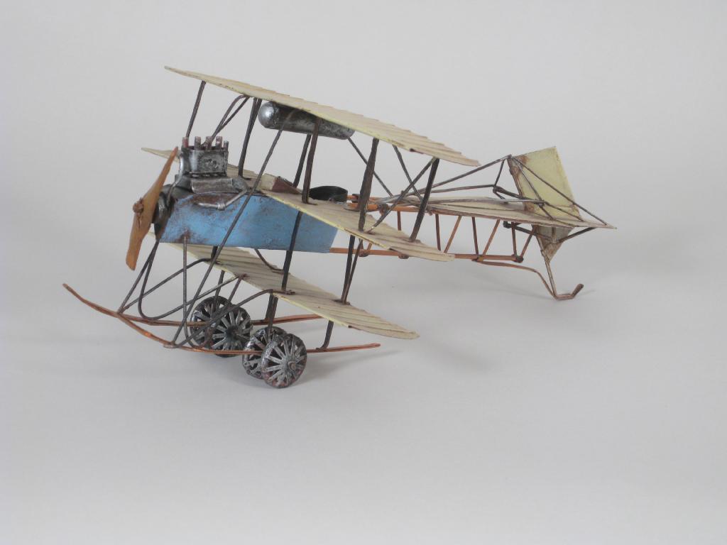 Appraisal: A rustic handmade tinplate Model of a Tri-plane and a