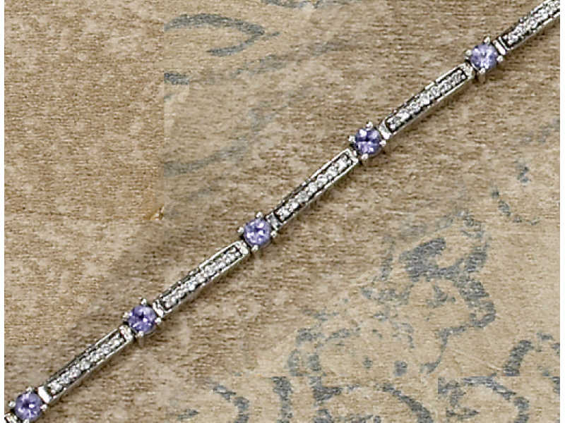 Appraisal: TANZANITE AND DIAMOND BRACELET k white gold with eleven prong