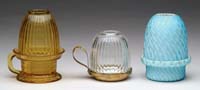 Appraisal: THREE FAIRY LAMPS Ruf fig similar Ribbed and swirled blue