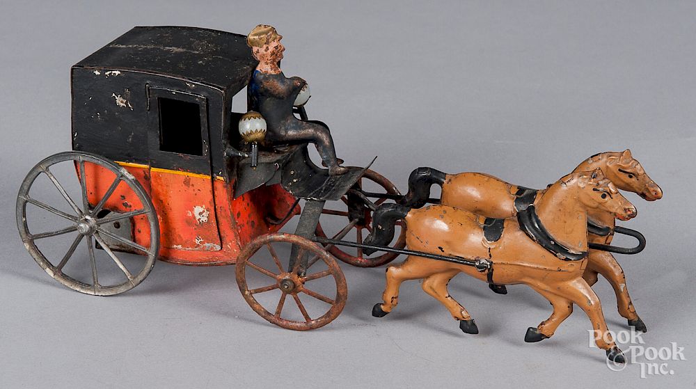 Appraisal: French clockwork tin horse drawn carriage French clockwork tin horse