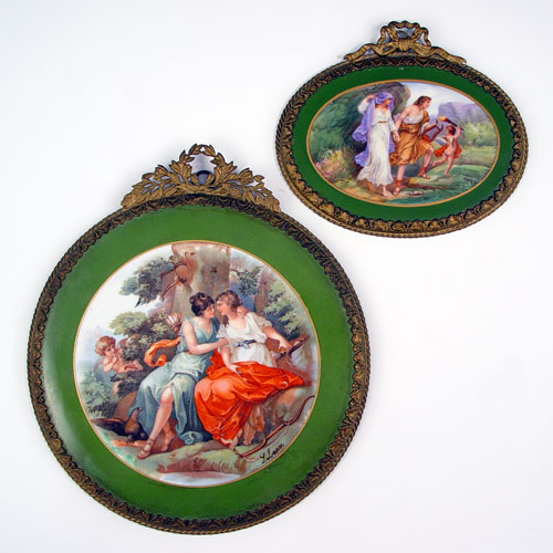 Appraisal: TWO FRENCH PORCELAIN CUPID PLAQUES Each plaque with an image