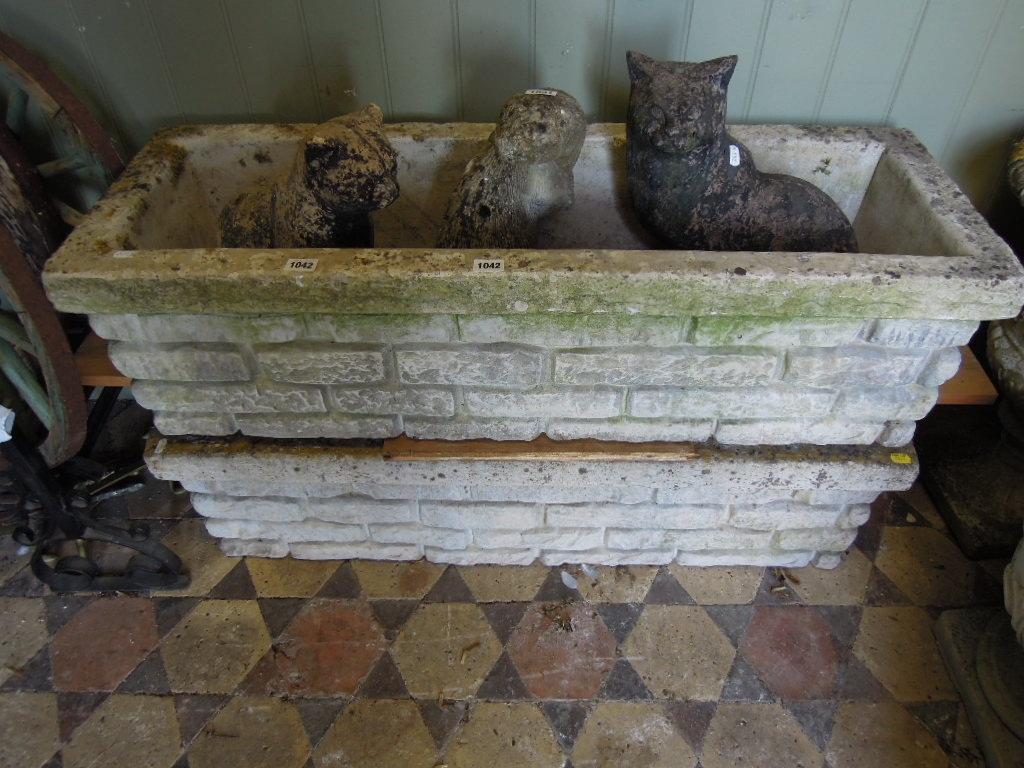 Appraisal: A pair of weathered composition stone cast planters of rectangular