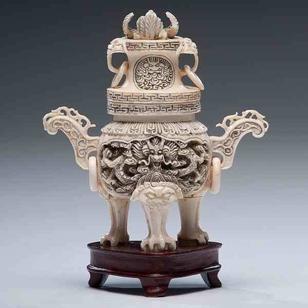 Appraisal: Chinese Carved Lidded Vessel Chinese A footed and lidded ivory