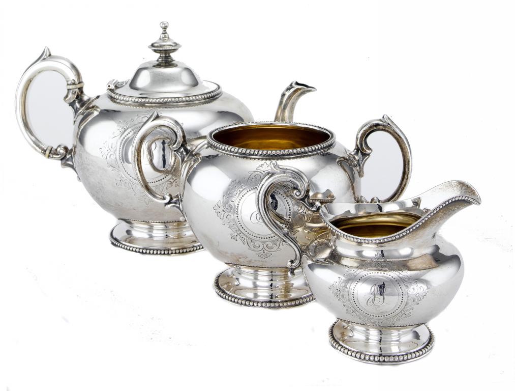 Appraisal: A VICTORIAN TEA SERVICE of globular form engraved with strapwork