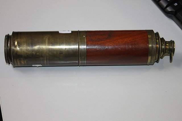 Appraisal: A TH CENTURY BRASS THREE DRAW TELESCOPE with mahogany binding