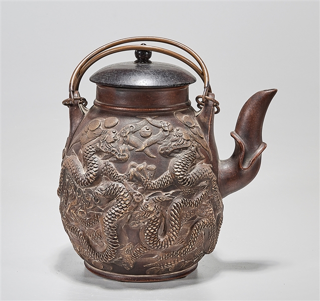 Appraisal: Large Chinese tea pot with dragons chasing pearls in relief