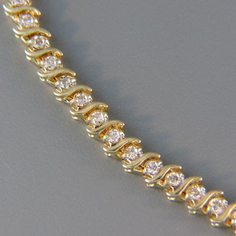 Appraisal: Diamond Bracelet round diamonds totaling carats in straight line style