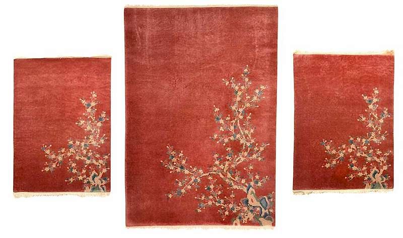 Appraisal: Three Peach Colored Chinese Rugs Chinese circa peach field with