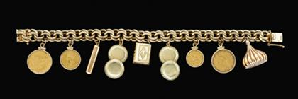 Appraisal: karat yellow gold charm bracelet Suspended with U S quarter