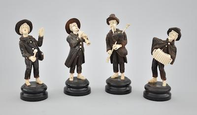 Appraisal: Four Carved Wood and Bone Figurines Depicting Musicians Each comically