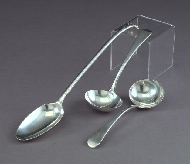 Appraisal: Pair of George III Sterling Silver Plain Antique Sauce Ladles