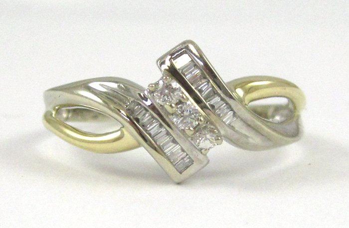 Appraisal: DIAMOND AND TEN KARAT WHITE GOLD RING with baguette-cut diamonds