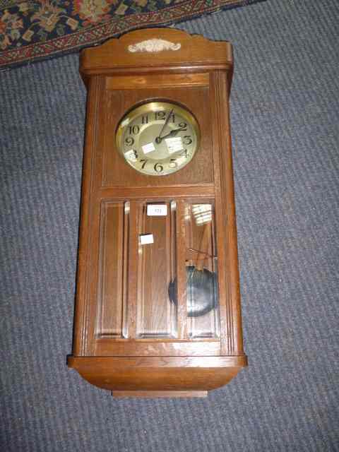 Appraisal: AN EARLY TO MID TH CENTURY OAK CASED WALL CLOCK