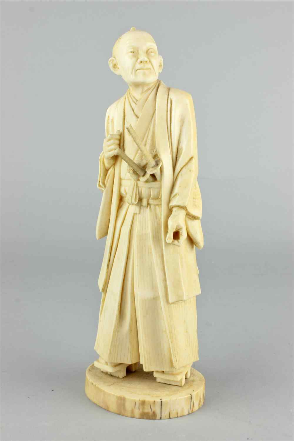 Appraisal: A JAPANESE CARVED IVORY FIGURE OF SAMURAI TH CENTURY the