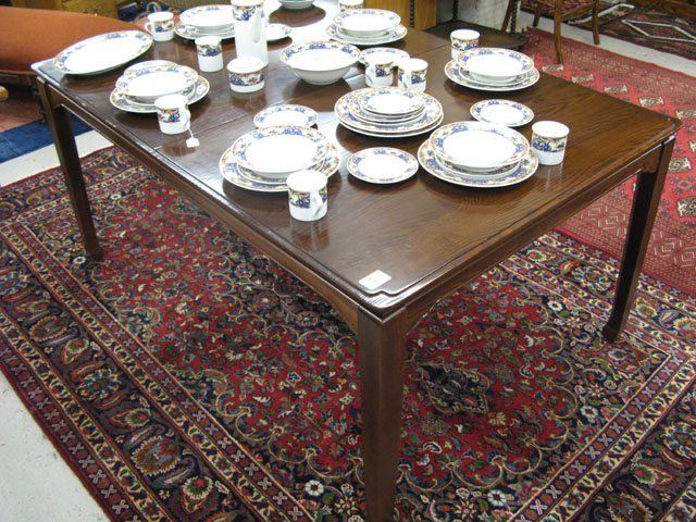 Appraisal: RECTANGULAR OAK DINING TABLE WITH THREE LEAVES American th century