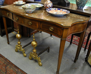 Appraisal: An Edwardian Sheraton revival mahogany and cross-banded carving table the