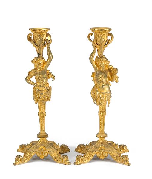 Appraisal: A pair of R gence style gilt bronze figural candlesticks