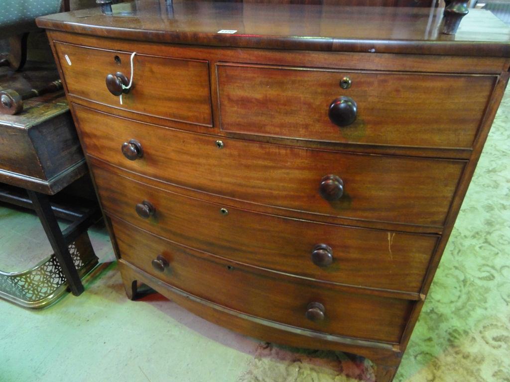 Appraisal: An early th century mahogany bow fronted chest fitted with