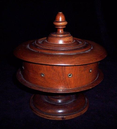 Appraisal: A Victorian treen cotton dispenser of turned form the lid