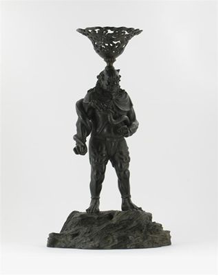 Appraisal: A Japanese bronze figure of a demon holding a writhing