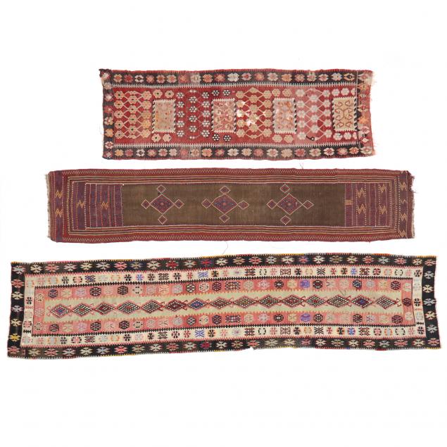 Appraisal: THREE TURKISH KILIM RUNNERS The first with repeating diamond-shaped medallions