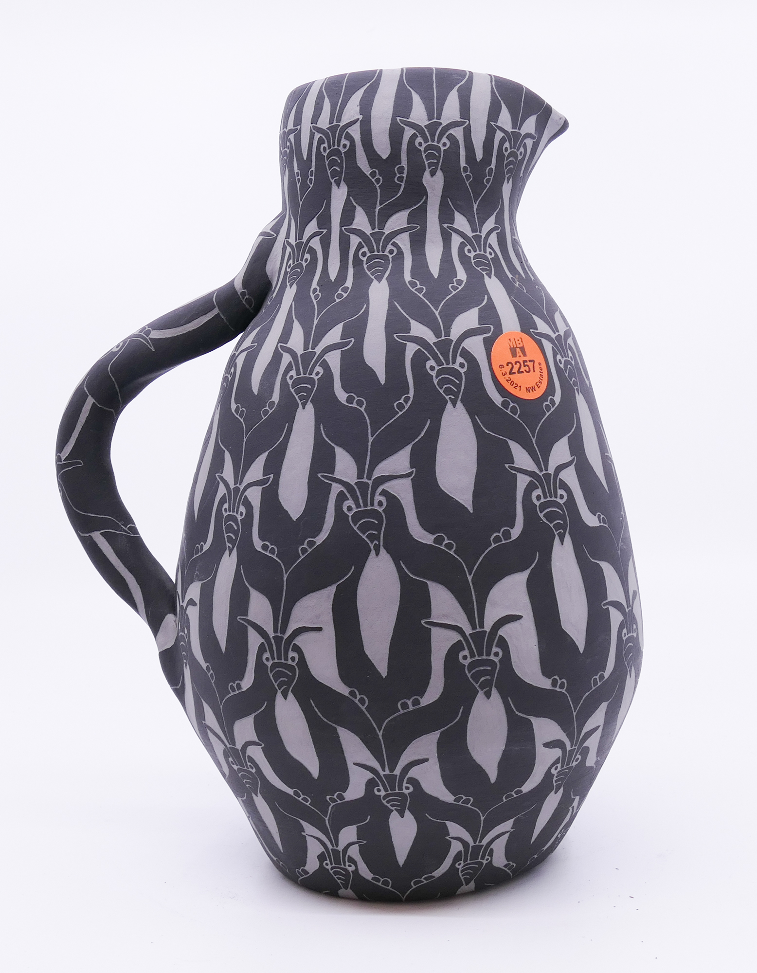 Appraisal: Kris Sivertsen Studio Pottery Underglaze Carved Penguins Pitcher- ''