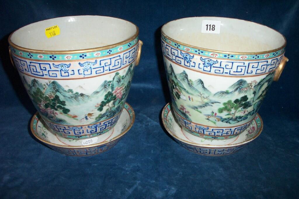 Appraisal: A pair of th century oriental cachepots with Famille Verte