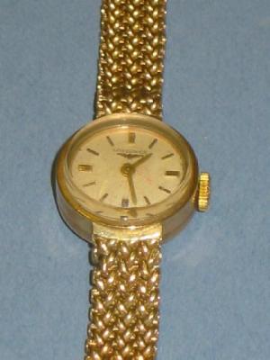 Appraisal: A CT GOLD LONGINES LADY'S WATCH with silvered circular dial