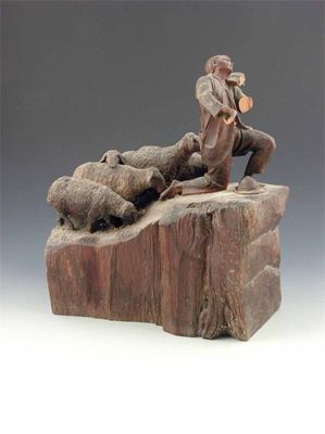 Appraisal: A carved Black Forest group of a shepherd playing a