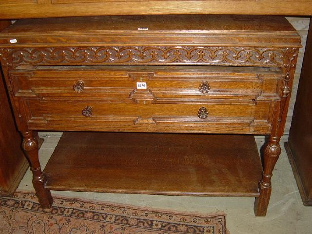 Appraisal: A continental oak cupboard on stand with rising lid over