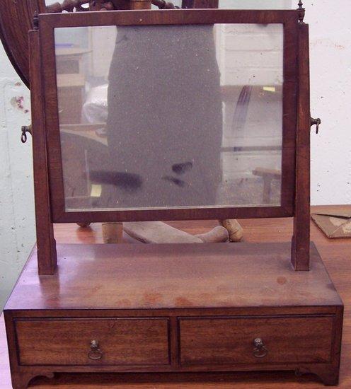 Appraisal: A George IV mahogany swing frame mirror the rectangular base