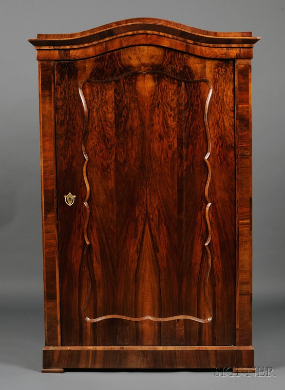 Appraisal: Biedermeier Walnut Armoire c with serpentine cresting above a conforming