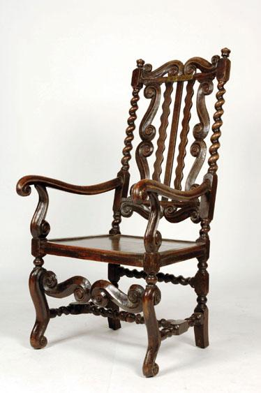 Appraisal: A WILLIAM AND MARY HIGH BACKED ARMCHAIR the raised back