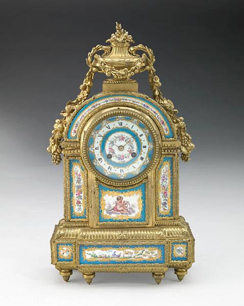 Appraisal: A French gilt bronze and porcelain mantel clock late th